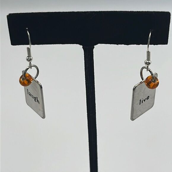 Silver-tone 1.5-in Dangling Orange Bead and Laugh Live Charm Earrings - Picture 1 of 11